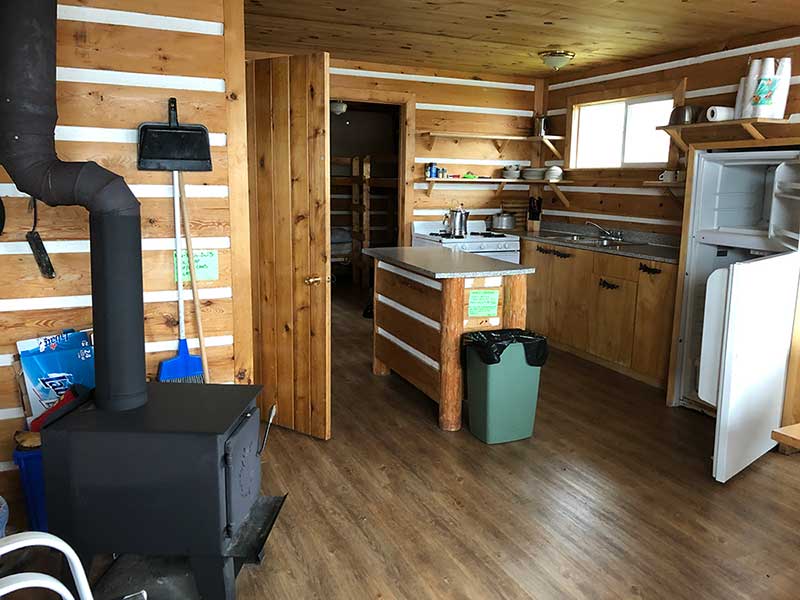 Interior of a cabin at Harrop Lake Wilderness Lodge showing kitchen